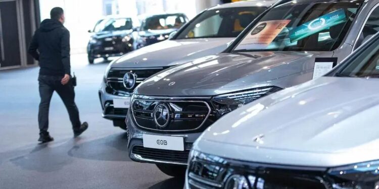 Mercedes-Benz electric vehicles inside a Mercedes-Benz AG showroom in Berlin, Germany, on Tuesday, Feb. 24, 2022. Mercedes-Benz expects profitability at its main cars division to slip this year as the German manufacturer sees more drag from supply-chain snarls and a surge in raw-material costs.